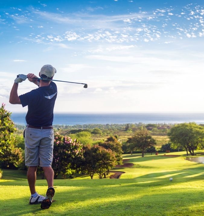 Golfer enjoying a scenic golf course in La Cala with a stunning sea view