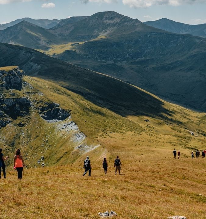 Hikers exploring the beautiful mountain trails around La Cala on a sunny day